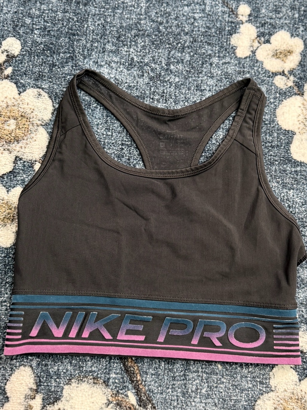 Nike DRI FIT Black Racerback Sports Bra with Pink and Blue Gradient Logo Band